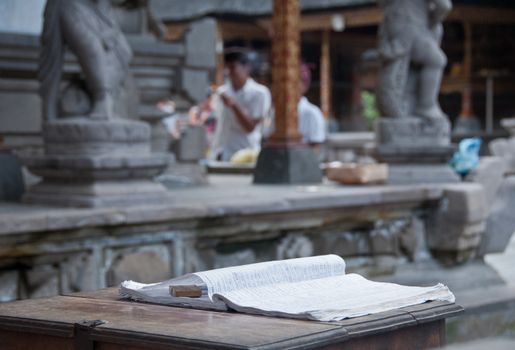 Guest book on wooden table in Bali Hindu temple