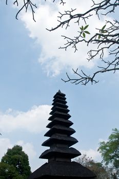 Taman Ayun Bali sacred temple with blue sky and trees