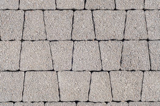 Background - gray paving stones of trapezoidal shape
