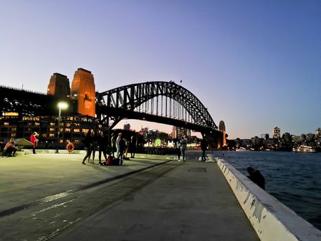 SYDNEY, AUSTRALIA - MAY 5, 2018: Sydney Harbour Bridge, which is a landmark near the famous Sydney Opera House in the evening.