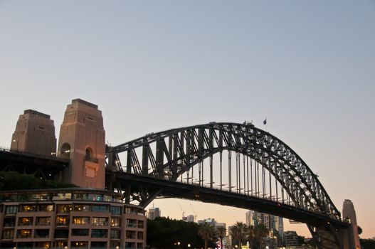 SYDNEY, AUSTRALIA - MAY 5, 2018: Sydney Harbour Bridge, which is a landmark near the famous Sydney Opera House in the evening.