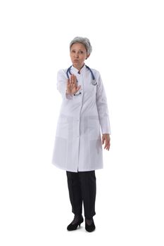 Asian mature female medical doctor with stethoscope showing stop gesture isolated on white background