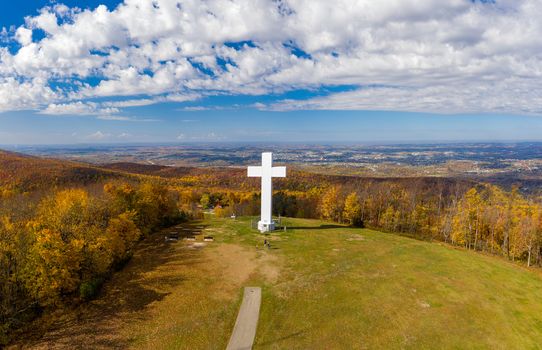 Aerial drone view of the metal structure of the Great Cross of Christ on Dunbar's Knob in Jumonville, PA