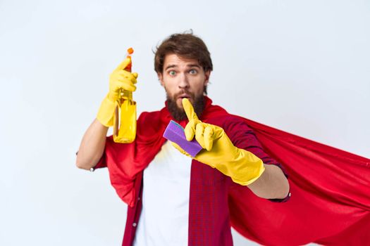 Man in red raincoat cleaning supplies housework service Professional. High quality photo