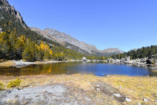 The Serva lake, a splendid alpine lake, in the natural park of Monte Avic in the Aosta valley