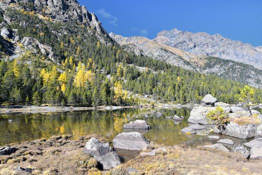 The Serva lake, a splendid alpine lake, in the natural park of Monte Avic in the Aosta valley