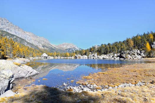 The Serva lake, a splendid alpine lake, in the natural park of Monte Avic in the Aosta valley