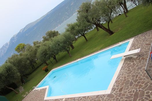 outdoor swimming pool with diving board