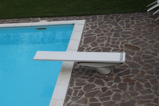 outdoor swimming pool with diving board
