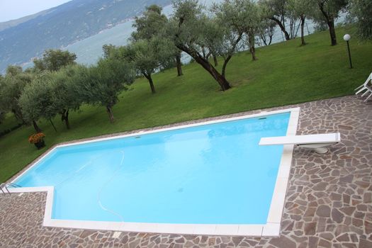 outdoor swimming pool with diving board