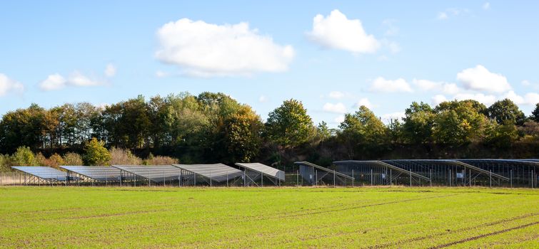 Generating clean energy with solar modules in a big park in northern Europe.