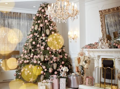 Christmas tree standing living room interior near fireplace gift box lie on carpet near evergreen fir Christmas time. Norning holidays