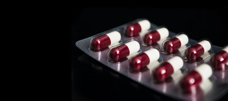 Medical concept, Drug capsule for treatment on black background.