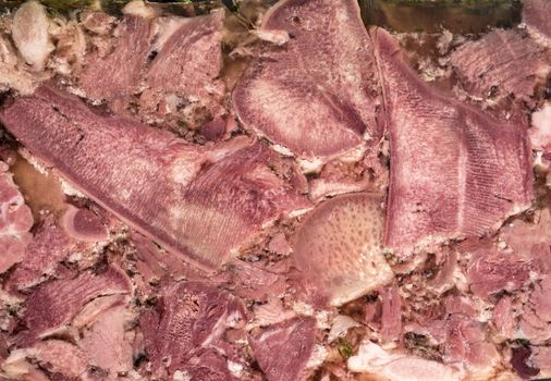 head cheese in front of white background 