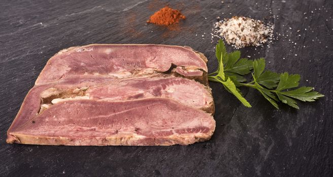 head cheese in front of white background 