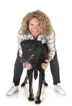 old beauceron and woman in front of white background