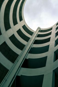 abstract geometry perspective of spiral ramp slope for parking space at a building for background, attractive exterior decoration with skylight, geometric pattern architecture