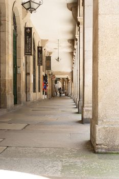 Santiago de Compostela, Spain, May 2018: View on the arcade streets of the old town of Santiago de Compostela in Spain