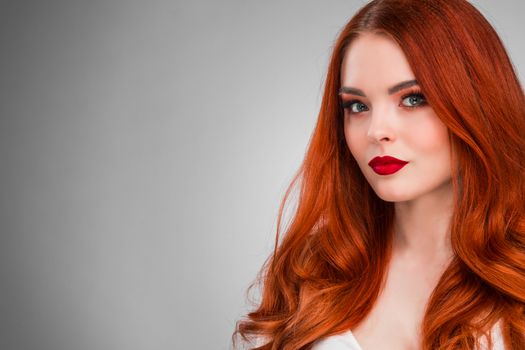 Beautiful Woman with Red Hair and bright makeup