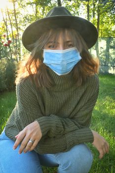 Woman Wearing Medical Protective Mask in Garden