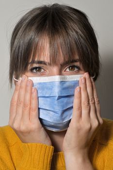 Woman Wearing Medical Protective Mask and Eyes Closeup