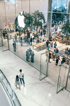 Customers visit Apple Store at The Iconsiam. It is the First Apple Store in Thailand. The Building is a large shopping mall by the Chao Phraya River in Bangkok