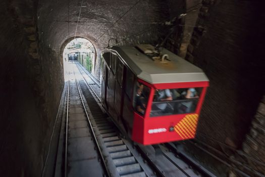 Upper city funicular line in Bergamo (Funicolare Citta Alta). Red funicular connects old Upper City and new. Bergamo (upper town), ITALY - August 19, 2020.