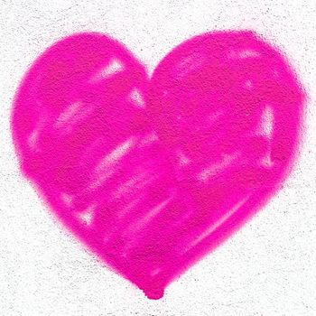 Pink heart on grungy wall. Creative spray paint. Ideal for Love and Valentine's Day concepts.