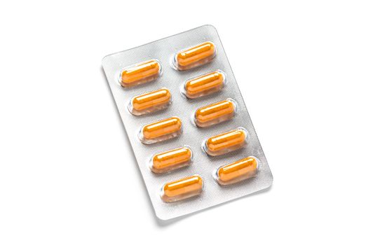 Turmeric capsules or Curcuma capsules in blister pack, medicines for health, pharmaceutical health care and sciences concept, shallow depth of field