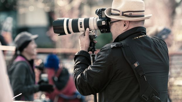 Photographer in running event at Seattle Center. All 15k finishers will receive official Hot Chocolate Seattle medal to commemorate their awesome achievement