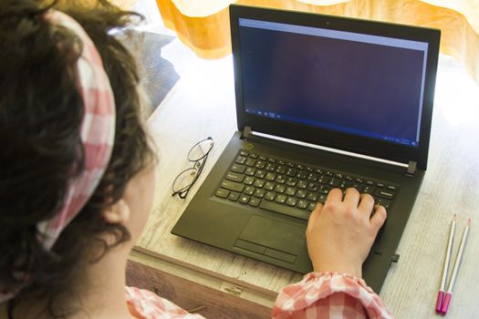 Woman working from home office, notebook or laptop, pencil and other things. Business working process, desktop and keyboard. Marketing photo.