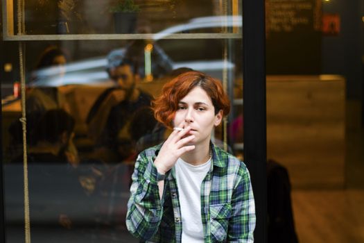 Woman portrait with cigarette, smoking scene. close-up portrait.