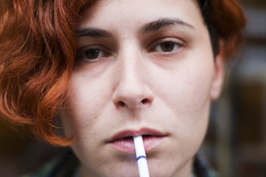 Woman portrait with cigarette, smoking scene. close-up portrait.