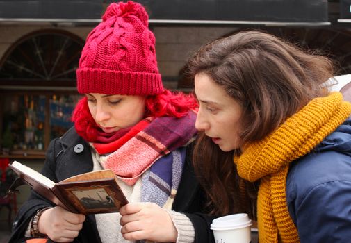 Two young woman looking to something, travelers and tourists in Istanbul