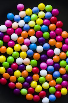 Skittles candy on the table, colorful sweet candy background