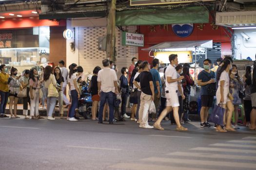 Bangkok Thailand - Oct 24, 2020 :- a lot of people, walking at Street food of Bangkok Some street vendors operate in groups the same place every night and have a different choice of meal