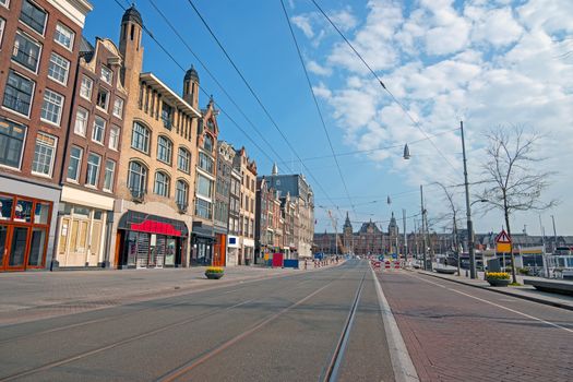 Empty Damrak during the Corona Crisis in Amsterdam the Netherlands