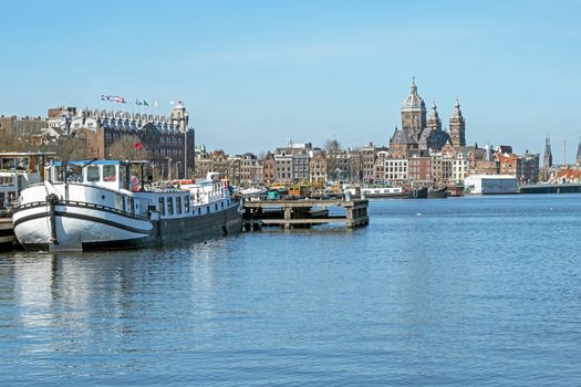 City scenic from  the harbor of Amsterdam in the Netherlands with the St. Niklaas church