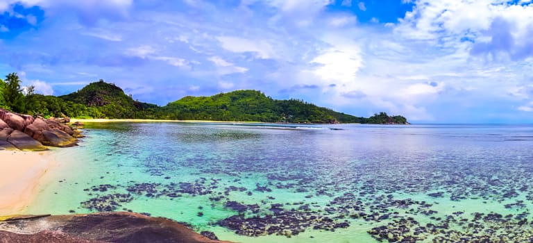 Stunning high resolution beach panorama taken on the paradise islands Seychelles.