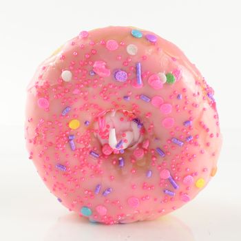 An isolated over white background image of a pink glazed donut.