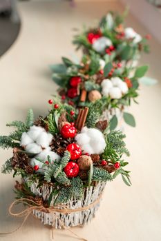 Christmas decoration with carnations, chrysanthemums santini, brunia and fir. Christmas spirit and mood