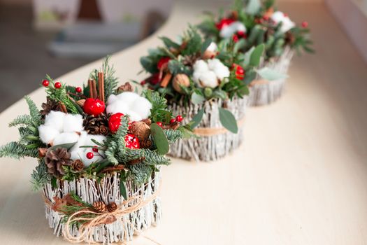 Christmas decoration with carnations, chrysanthemums santini, brunia and fir. Christmas spirit and mood