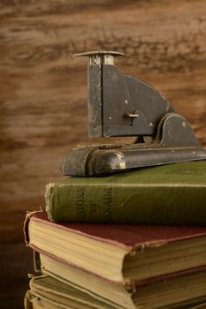 A stack of old books with a vintage feel to the image.