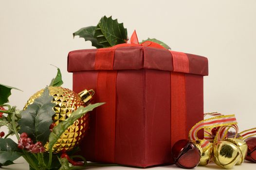 A red gift box to be given during the holiday season festivities.
