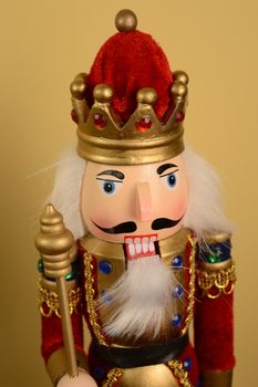 A closeup of the face of a king nutcracker figure.