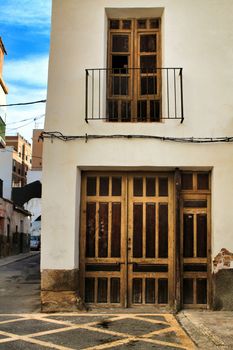 Old colorful and majestic tiled facades in Elche, Alicante, Spain. El Raval neighborhood.