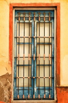 Old colorful typical facade in Lisbon with vintage wooden window