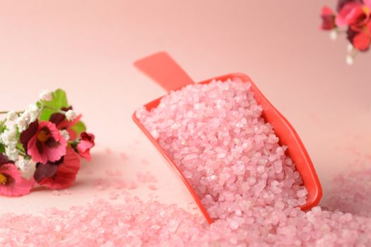 A scoop of cleansing pink bath salts to add to your hygiene routine.