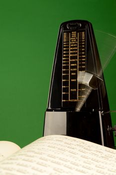 A closeup view of a metronome to make some music.