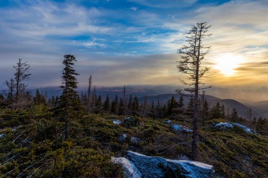 Sunset on the Tukuringra ridge. Beautiful winter sunset on the top of the mountain.